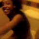 A low-quality, shaky video in which a black girl sitting on a toilet is captured on video by surprise.